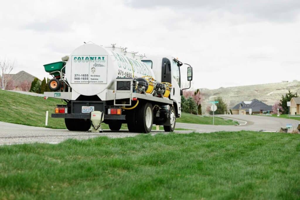 schedule your lawn treatment service with Colonial Lawn and Garden
